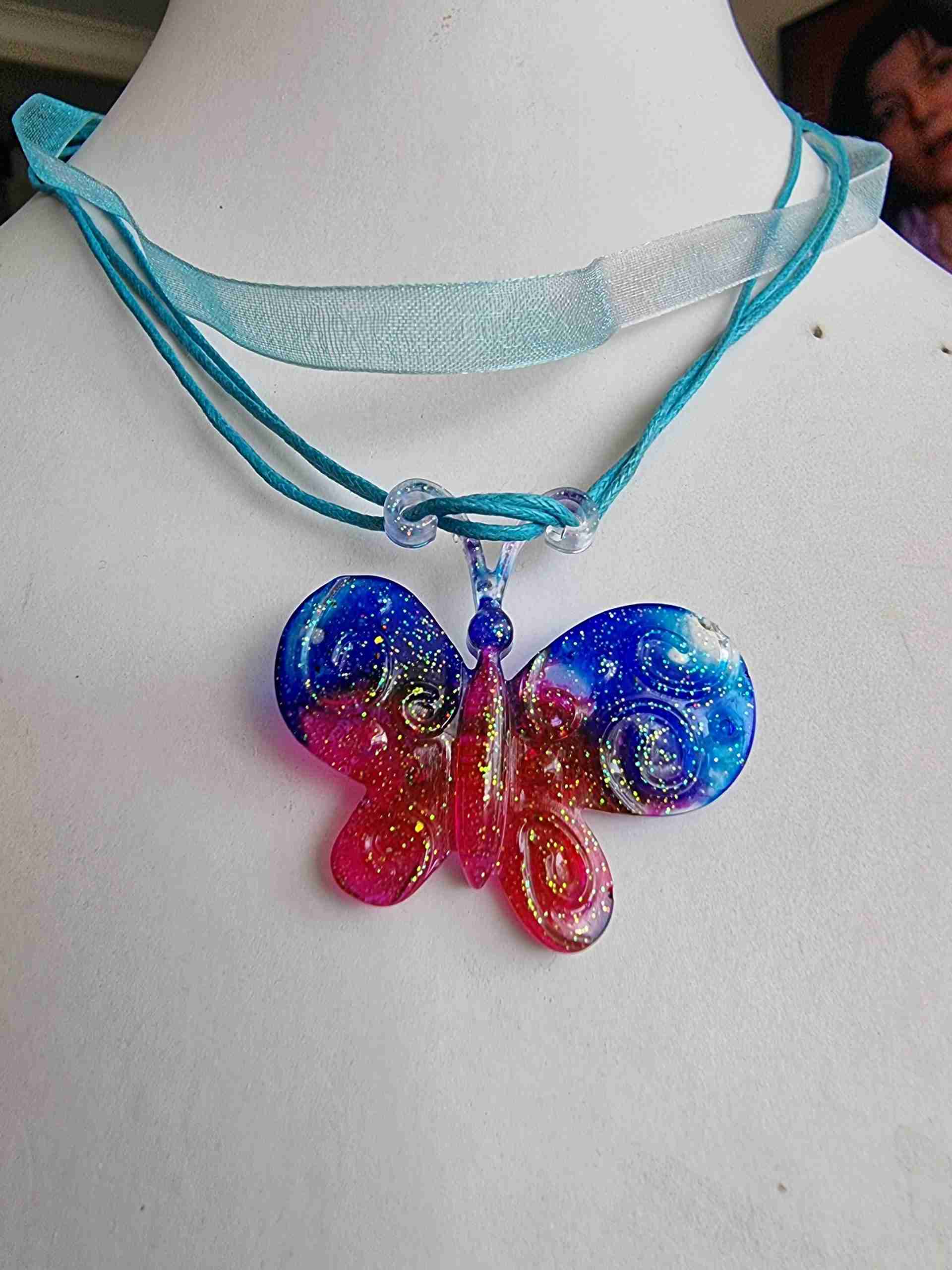pink and blue glittery butterfly necklace