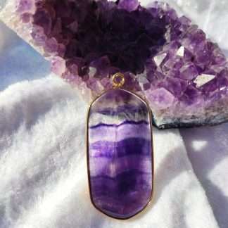 Framed fluorite crystal slice pendant.