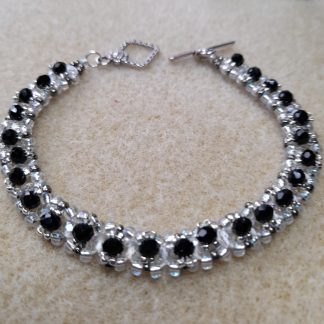 Hand made bracelet With Swarovski crystals in clear and black color
