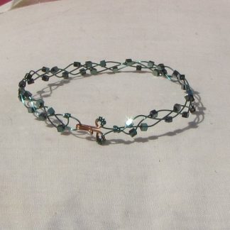 Sea-green coloured copper plaited bracelet with shiny mermaid green coloured hematite cubes