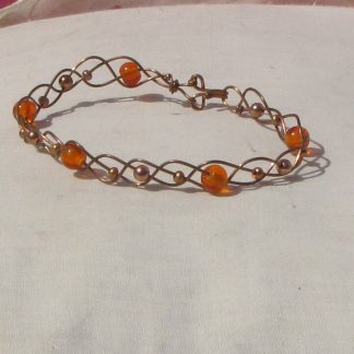 Copper and orange glass beads plaited bracelet. 183
