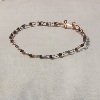 Copper plaited bracelet with shiny mermaid green, blue and purple coloured hematite cubes