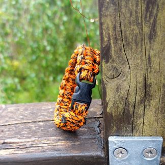 Paracord Bracelet. Orange paracord in a Cobra pattern.